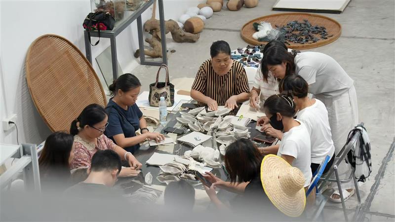 Community residents participate in the creative process in the artist
