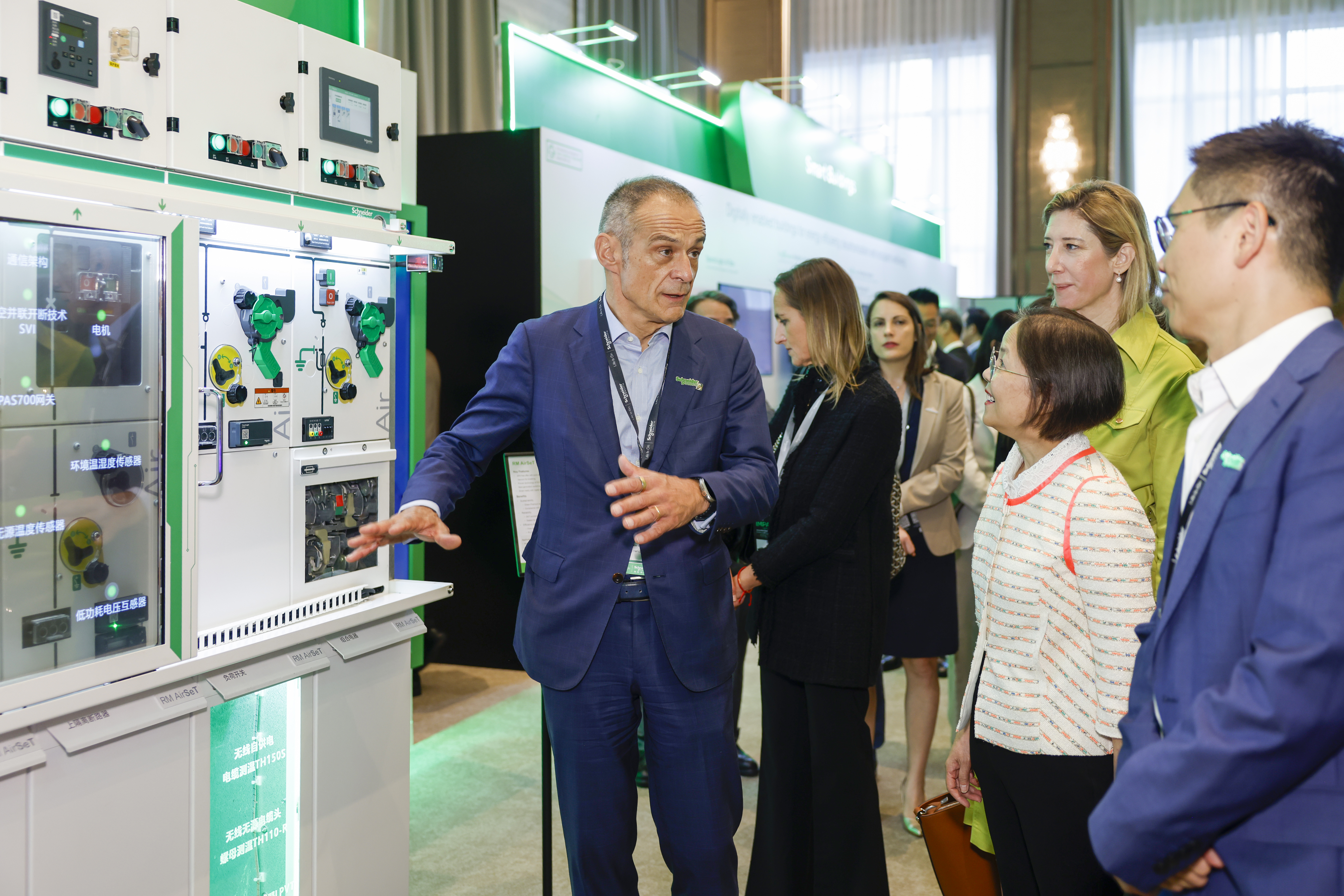 Mr Jean-Pascal Tricoire, Chairman of Schneider Electric (front left), and Mr Jonathan Chiu, President of Schneider Electric Hong Kong (far right), introduce the company’s sustainable and digital innovations to Miss Diane Wong, Under Secretary for Environment and Ecology (2nd from right), and Ms Christile Drulhe, Consul General of France in Hong Kong and Macau (2nd from left), during Innovation Summit Hong Kong 2025.
