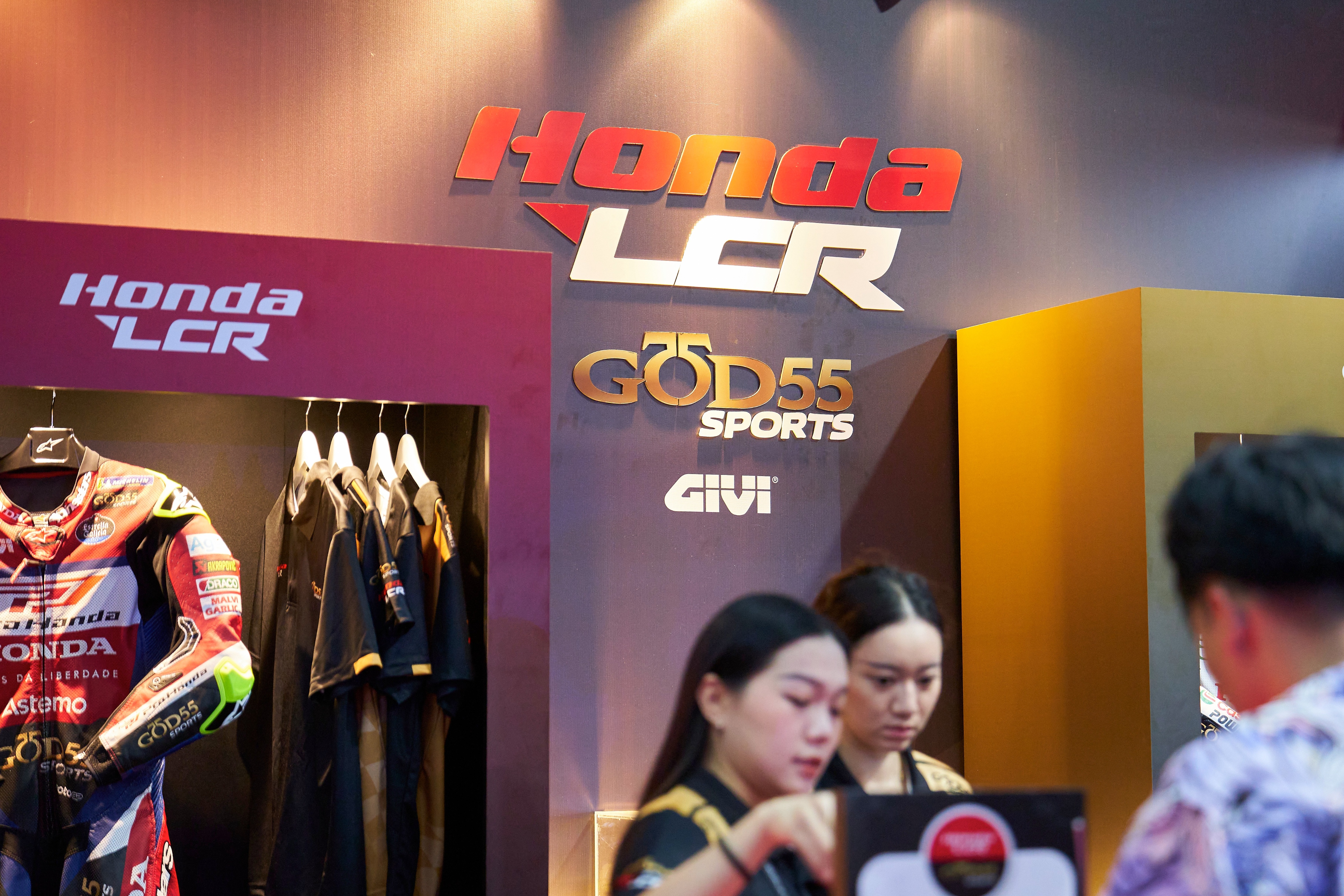 Honda LCR x GOD55 Sports logo at the MotoGP Launch booth