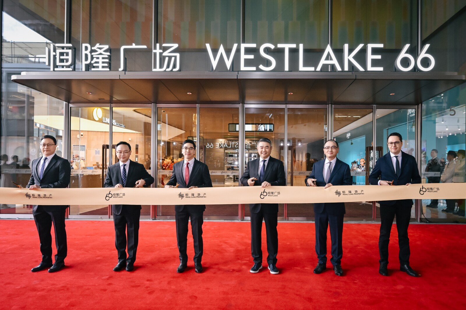 Members of Hang Lung's senior management officiate at the ribbon cutting ceremony of Westlake 66 in Hangzhou (from left to right): Mr. Herman Chui, Senior Director – Office, Hotel & Residence; Mr. Kenneth Chiu, Chief Financial Officer; Mr. Adriel Chan, Chair; Mr. Weber Lo, Chief Executive Officer; Mr. Derek Pang, Senior Director – Mainland Business Operation; Mr. Mikael Jaeraas, Senior Director – Retail and Hong Kong Business Operation